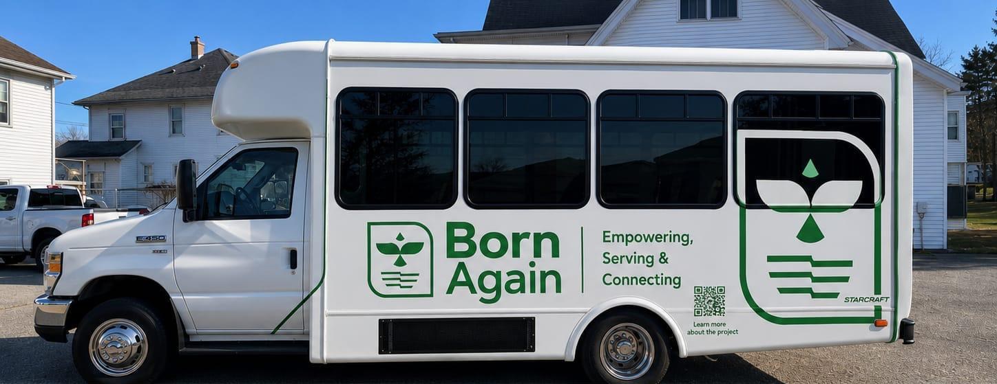 Side of the Born Again bus with its visual identity applied